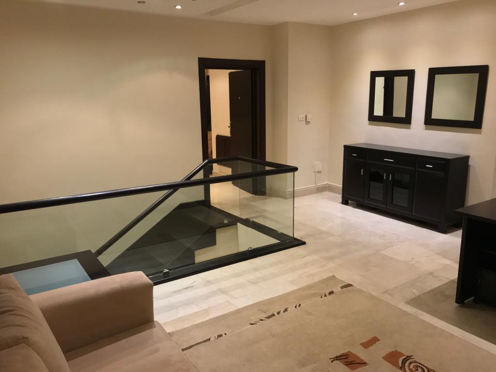 A fourth-floor apartment with a roof, available for rent or sale in Abdoun. - Property Image 19